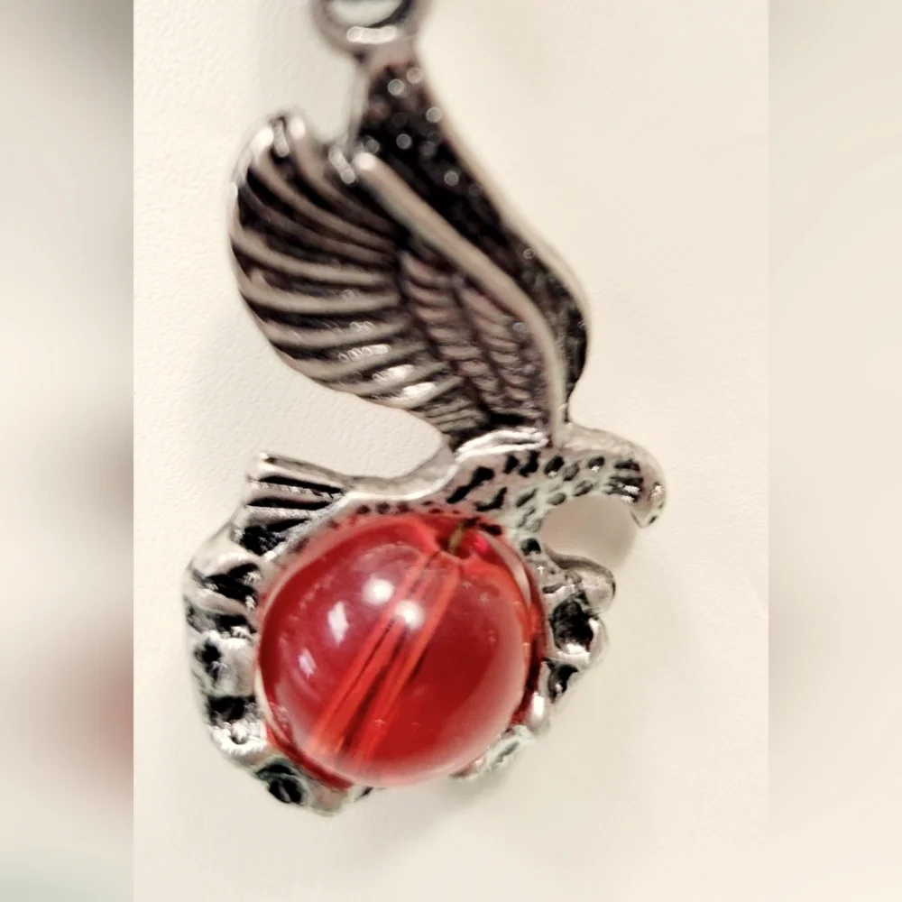 Necklace with Eagle holding a red glass orb